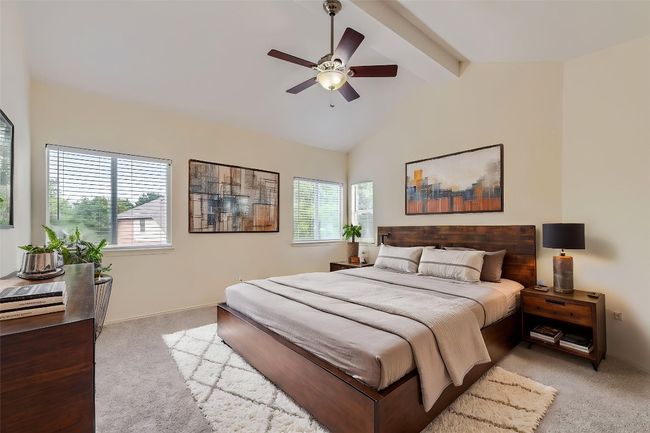 Bedroom featuring light carpet and a ceiling fan | Image 13