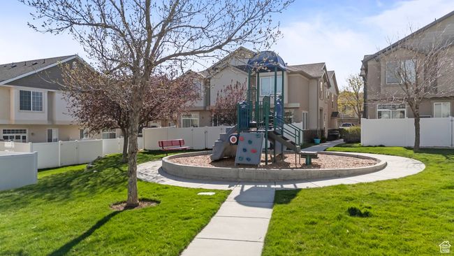 View of home's community featuring fence, a lawn, a residential view, and playground community | Image 17