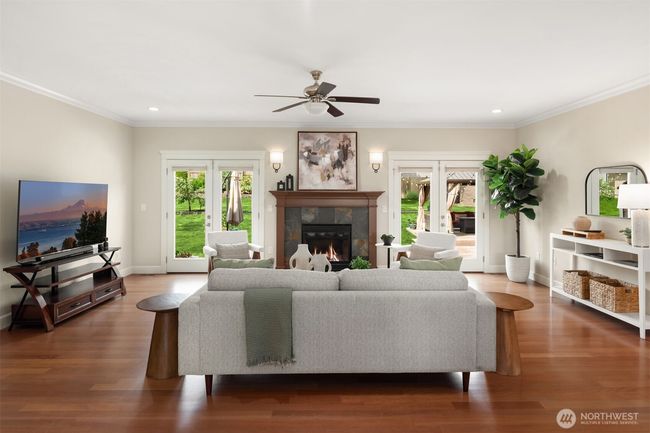 Huge family room with French doors leading out to the massive patio | Image 11