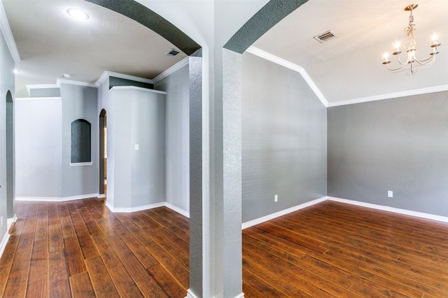 When you enter the home, the formal dining room can easily accommodate an oversized table, but you can use this room for whatever works best for you! | Image 5