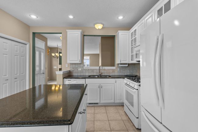 Convenient pull outs in an abundance of cabinetry and storage. | Image 19