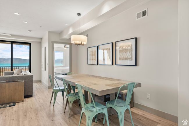 Dining space featuring light wood-type flooring, baseboards, and recessed lighting | Image 47