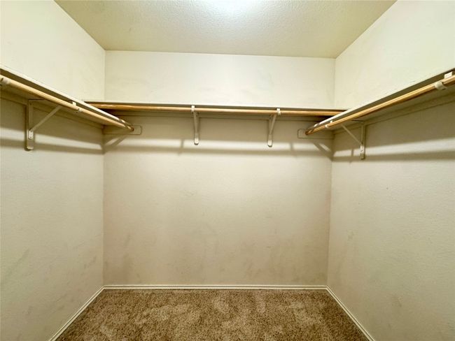 Spacious closet featuring carpet flooring | Image 15