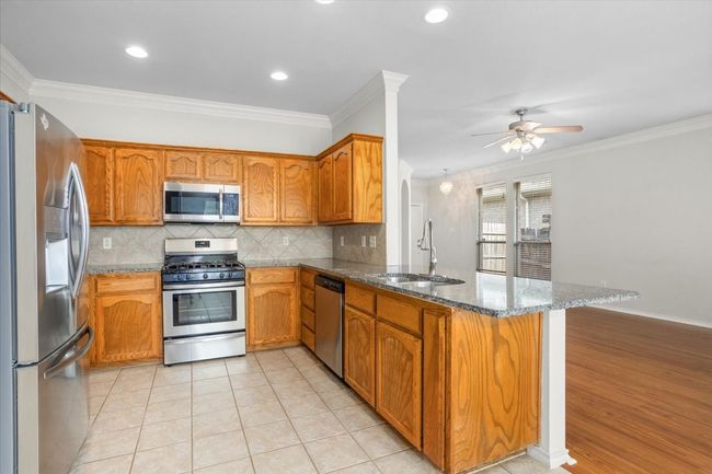 Don't miss the breakfast bar between the living room and kitchen! | Image 8