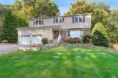 View of front of property with a front lawn and a garage | Image 2