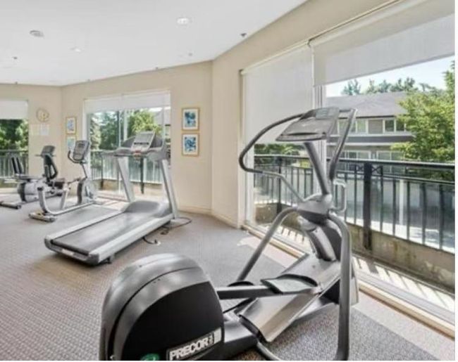 Gym with carpet flooring and baseboards | Image 15