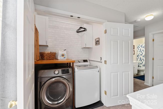 UPGRADED laundry area with folding area | Image 15