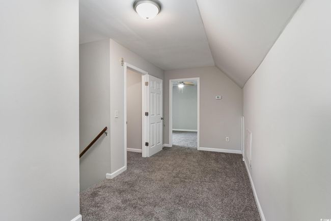 Bonus room featuring lofted ceiling, carpet floors, and baseboards | Image 9