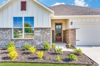 View of front of property featuring a garage | Image 1