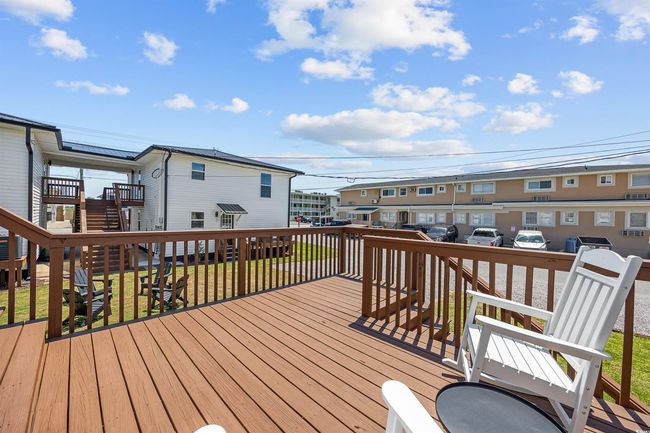 Wooden terrace featuring a residential view | Image 34