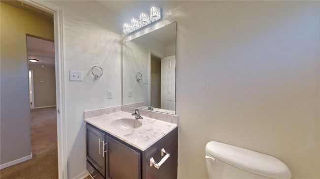 Stylish third guest bathroom upstairs with modern fixtures and elegant finishes. | Image 38