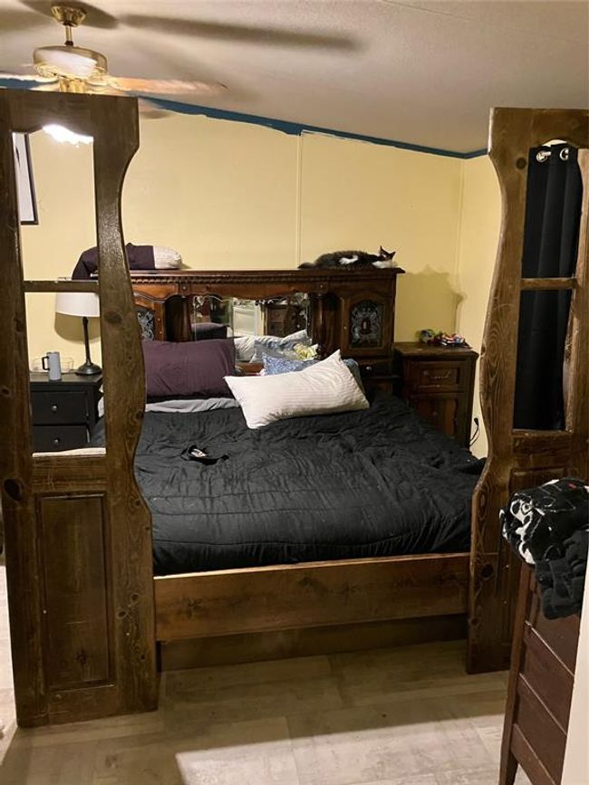Bedroom with ceiling fan and wood-type flooring | Image 16