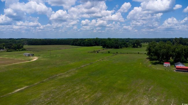 Aerial view of sparsely populated area with a pastoral area | Image 31