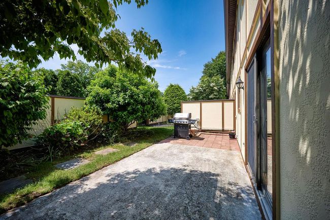 View of patio featuring area for grilling | Image 15