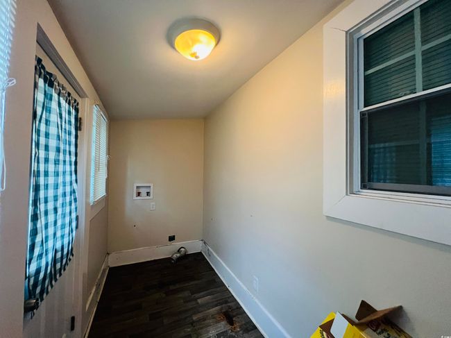 Laundry area featuring hookup for a washing machine, dark wood-style flooring, laundry area, and baseboards | Image 8