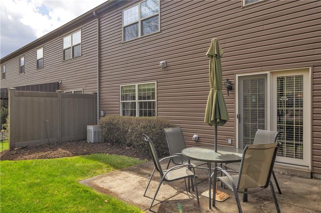 Patio and Grassy Area in Back with Access from the Kitchen. | Image 15
