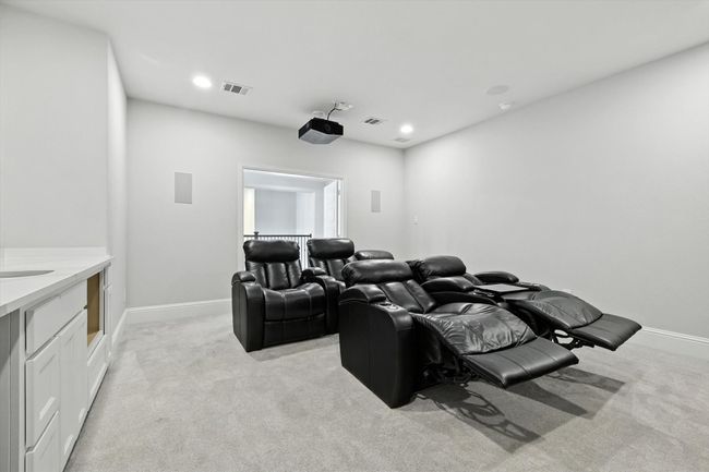 Cinema room featuring light colored carpet and recessed lighting | Image 31