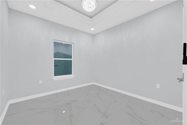 Spare room featuring baseboards and marble finish floor | Image 22