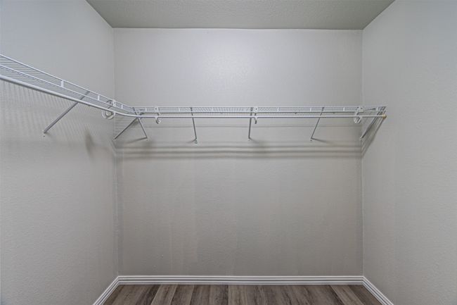 Spacious closet featuring wood finished floors | Image 17