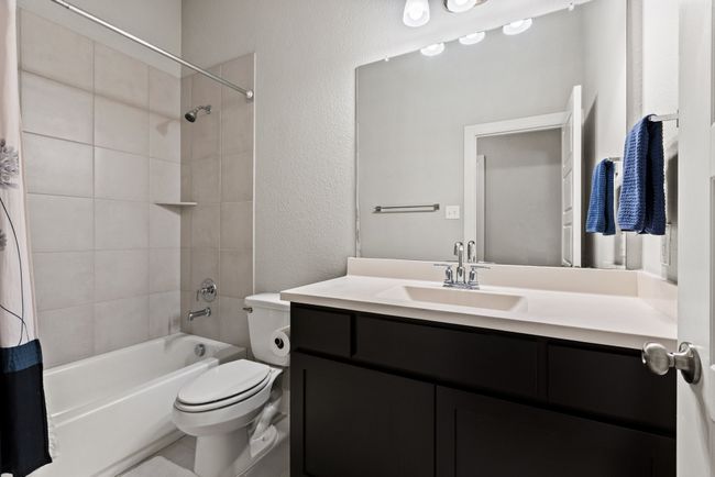 Full bath with shower/tub combo and it serves bedrooms 2 and 3 | Image 14