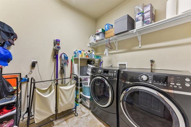 Tucked away near the bedrooms, the laundry room offers plenty of space to sort, fold, and organize, making everyday chores feel a little more manageable | Image 30