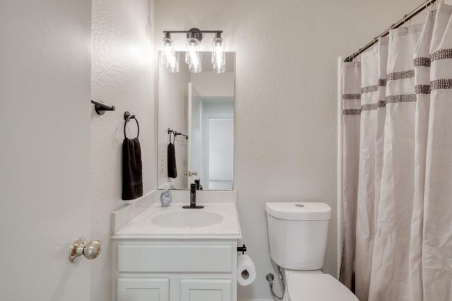 Full bath featuring vanity and curtained shower | Image 22