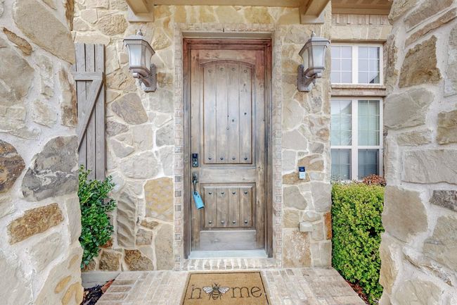 Property entrance featuring stone siding | Image 7
