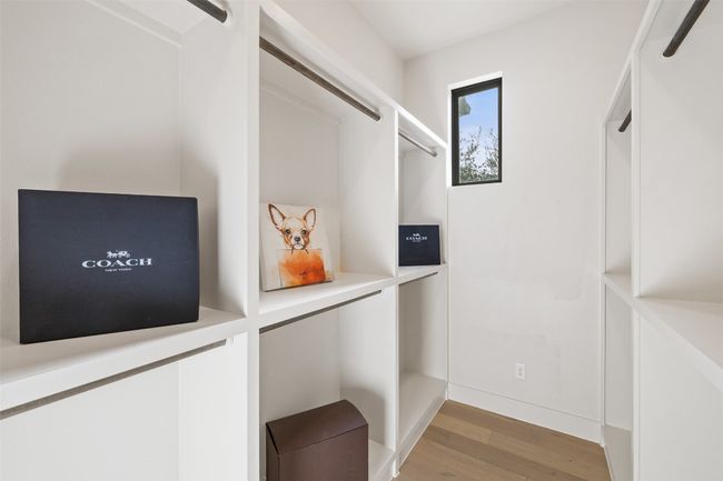 Walk in closet featuring light wood-type flooring | Image 22