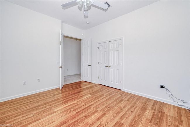 Unfurnished bedroom with ceiling fan, light hardwood / wood-style floors, and a closet | Image 5