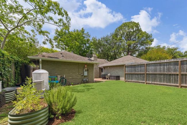 Beautiful, vibrant backyard oasis perfect for outdoor gatherings. | Image 21