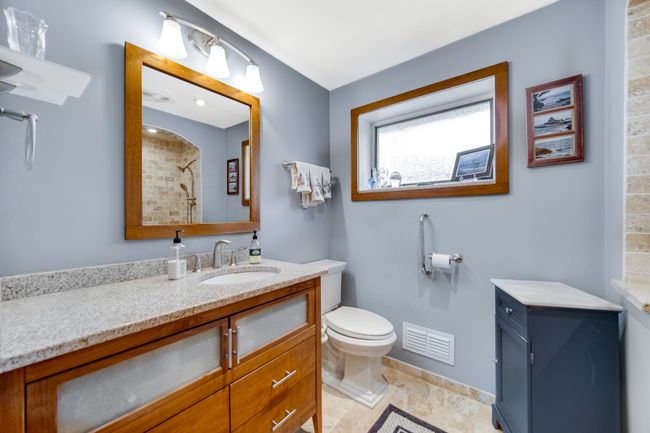 Amazing shower with bench, tile feature, and three | Image 5