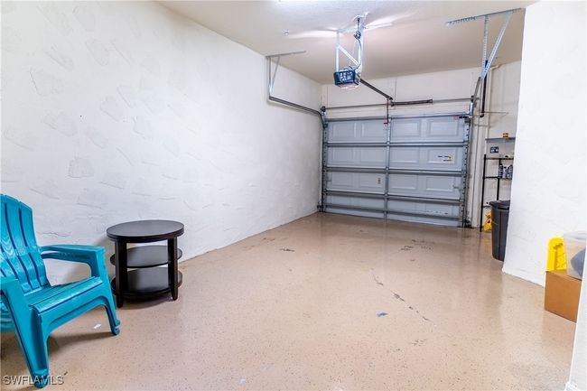 Garage with a garage door opener | Image 26