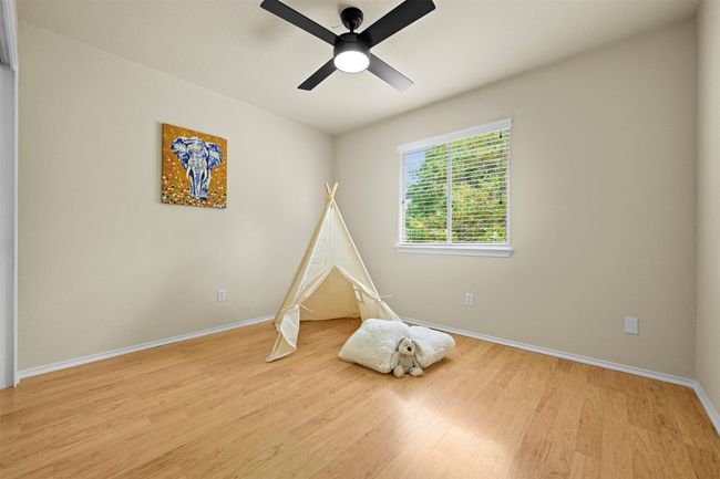 Rec room featuring wood finished floors and a ceiling fan | Image 29