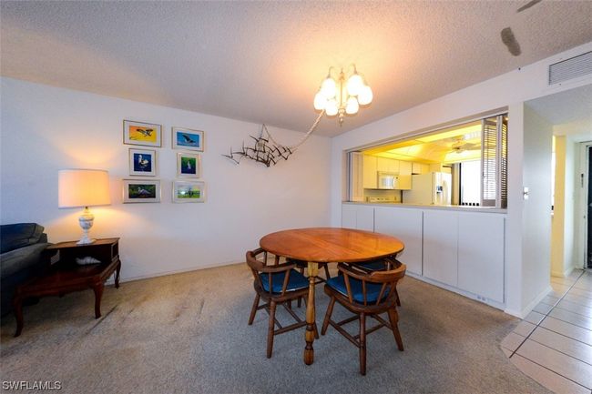DINING AREA. PASS-THROUGH TO KITCHEN WITH LOUVERED SHUTTERS. EXTRA STORAGE. | Image 13