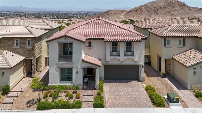 Mediterranean / spanish house with stucco siding, driveway, a garage, and a mountain view | Image 61