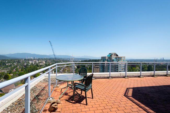 View of patio featuring a balcony and a mountain view | Image 24