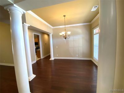 Beautiful hardwood flooring, high ceilings, and crown molding giving you an elegant feel. | Image 3