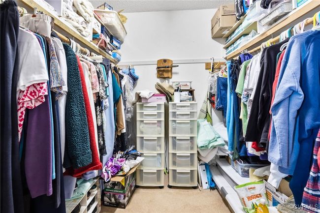 Spacious closet with carpet flooring | Image 12