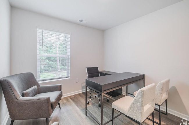 Office space featuring wood finished floors and baseboards | Image 14