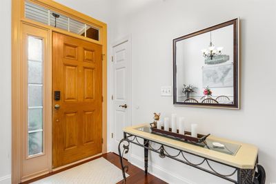 Entrance foyer featuring wood-type flooring and a chandelier | Image 2