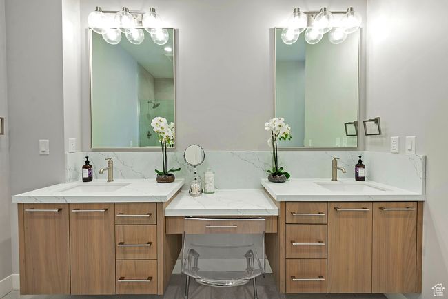 Full bathroom with two vanities, walk in shower, and a sink | Image 21