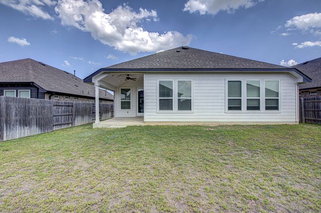 Rear view of property with ceiling fan and a patio area | Image 23