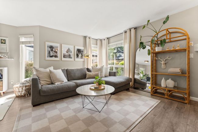 Living area with light wood-style floors and baseboards | Image 9