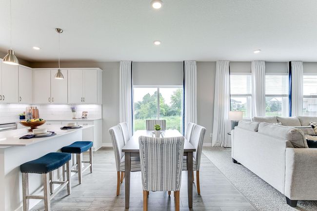 Kitchen and dinette with more seating at the breakfast bar. | Image 10