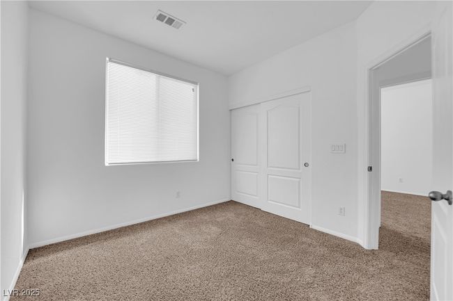Unfurnished bedroom featuring a closet, visible vents, carpet flooring, and baseboards | Image 13