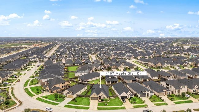 Amazing aerial shot of this gorgeous home situated on a quiet street in the sought after community of Cross Creek Ranch zoned to Lamar Consolidated ISD. Lush landscaping, well manicured front lawn and a wonderful back patio perfect to set up and an outdoor sitting area. | Image 21