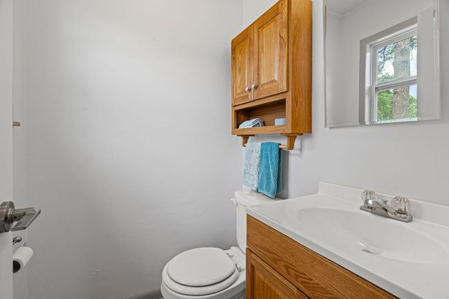 Bathroom featuring toilet and vanity | Image 29