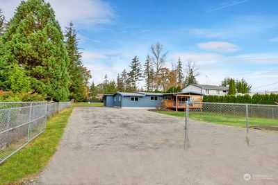 Fully fenced yard surrounding remodeled rambles | Image 2