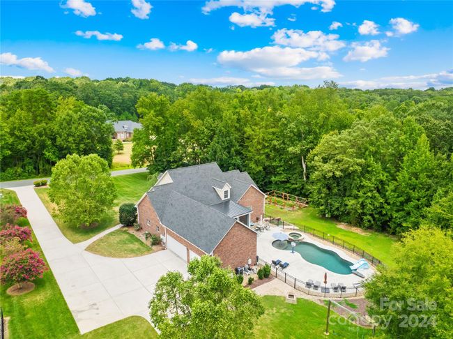 From the vegetable gardens to the backyard oasis with an in-ground salt water pool, this lovely home and acreage will give you the lifestyle you are dreaming of! | Image 29