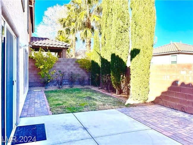 View of yard featuring a patio area and a fenced backyard | Image 19
